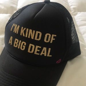 Trucker hat. “I’m kind of a Big Deal”.